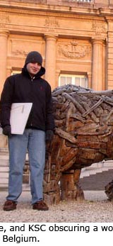 Daniel Graf, Jonah White, and Kevin Cummings obscuring a wooden elephant at MRAC, Tervuren, Belgium.